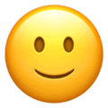 Image of a slightly smiling face emoji