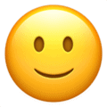 Image of a slightly smiling face emoji